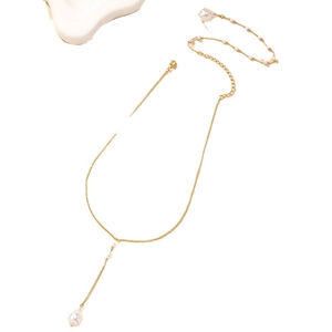 Elegant gold Y-shaped lariat necklace featuring round white pearls and a teardrop pendant