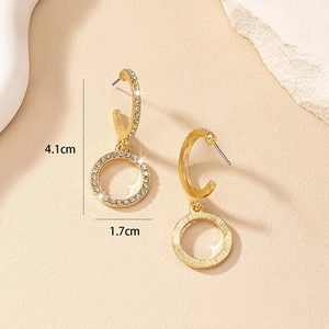 Detail view of gold C-shaped earrings with rhinestones measuring 4.1cm by 1.7cm
