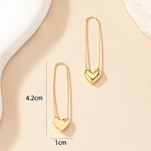 Detail view of gold heart safety pin earrings with 4.2cm length dimensions shown