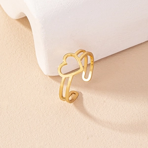 Detailed view of a minimalist gold hollow heart open ring with a polished metallic finish