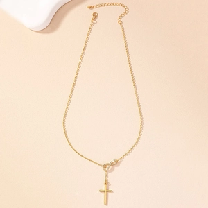 Collana dorata con pendente infinito e croce con diamanti su una catena sottile a Y