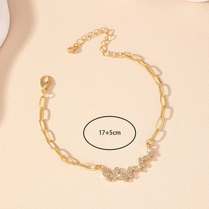 Detail view of butterfly bracelet featuring sparkling rhinestones with 17+5cm size label