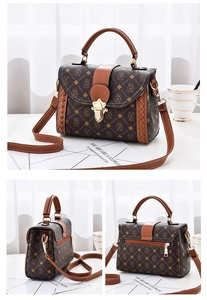 Detail view of woven leather stitching and rear zipper pocket on vintage monogram crossbody bag