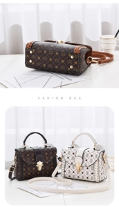 Detail of metal hardware base and contrast patterned flap bag with crown bear prints