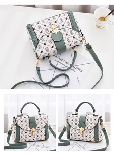 Detailed view of cream PU leather handbag with vintage bear print and gold clasp lock