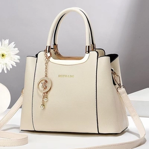 Elegant cream lychee pattern tote bag with gold lettering and decorative star charm
