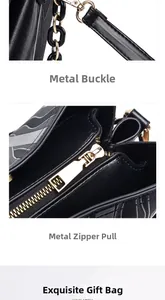 Detail von Metallreißverschluss und Hardware-Verschluss an schwarzer Eimertasche