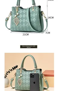 Detailed dimensions of mint green quilted tote with smartphone size comparison