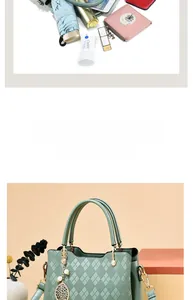 Detail showing high-capacity interior of grey-green quilted leather tote with leaf charm