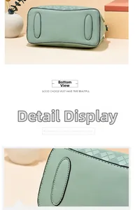 Detailed base view of light green tote with protective oval pads and diamond texture