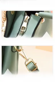 Close-up of mint green PU handbag showing golden hardware and reinforced stitching details