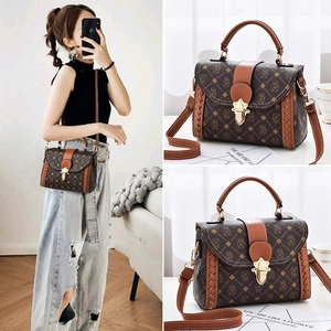 Classic brown retro satchel bag with crown pattern and metallic lock for women