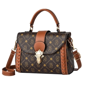 Retro monogram crossbody bag with orange leather trim and decorative metal buckle clasp