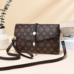 Classic dark brown printed crossbody bag with stone texture and gold hardware detail