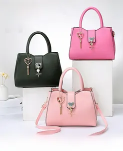Minimalist tote bags in black, magenta, and pink with heart and bear charms