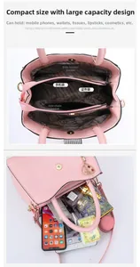 Detailed interior of the pink handbag showing multiple compartments and large capacity