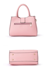 Pink crossbody bag back view with metal zipper and bottom protective gold studs