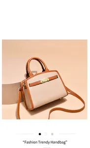 Dettaglio della fibbia dorata e bordo marrone su una borsa a trapezio in pelle beige