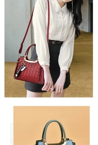Detail of woven texture handbag featuring round metal handles and decorative charms