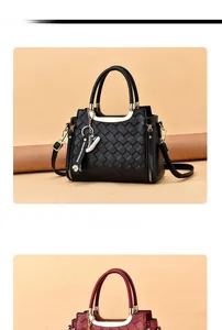 Detail of woven texture black shoulder bag with metal rings and letter pendant decor
