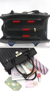 Détails de l'intérieur du grand sac noir montrant les compartiments pour tablette et objets