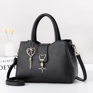 Minimalist black pebbled leather tote bag with heart tassel and cute cat star charms