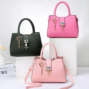 Three minimalist PU leather tote bags in black, pink, and rose red with bear snap buckles