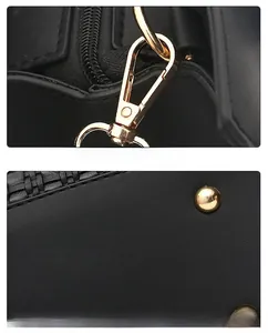 Détail de crochets en métal doré et de rivets sur un sac en cuir noir texturé