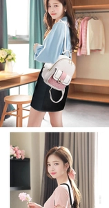 Detailed view of mini pink and white backpack with quilted texture and plush ball charm