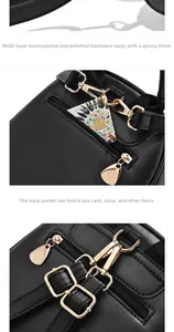 Detail of black lychee leather backpack showing golden hardware and back anti-theft zipper