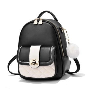 Quilted black and white contrast leather backpack with gold bee detail and fur pompom