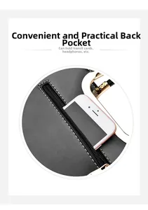 Detail of the back zipper pocket on a black leather tote bag with a smartphone inside