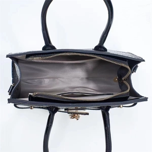 Black lizard embossed tote bag with gold hardware and spacious interior view