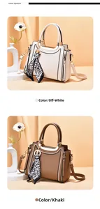 Detail of off-white and khaki leather tote bags featuring decorative leopard print silk scarves