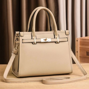 Beige lychee texture leather handbag with gold metal clasp and detachable strap