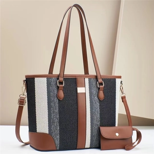 Minimalist striped tote bag set with brown leather straps and adjustable crossbody strap