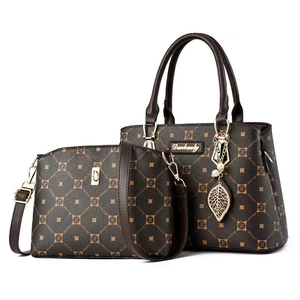 Two-piece brown printed handbag set with leaf charm and geometric diamond pattern