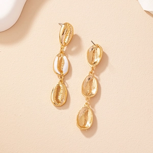 Golden bohemian shell drop earrings with white enamel finish and triple tier design
