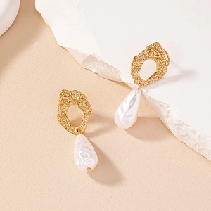 Baroque irregular pearl drop earrings with golden lava texture on a natural stone base
