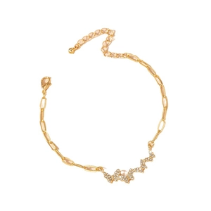 Elegant gold butterfly bracelet featuring sparkling pavé diamonds and adjustable lobster clasp