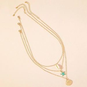 Three-layer gold necklace set featuring seashell, starfish, and scallop shell pendants