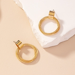 Minimalist geometric gold multi-circle earrings with artistic stone display