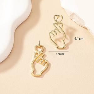 Detailed view of gold finger heart earrings with dimensions 4.1cm by 1.9cm