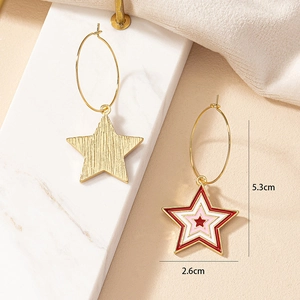 Detail view showing asymmetrical star earrings with enamel texture and 5.3cm size measurement