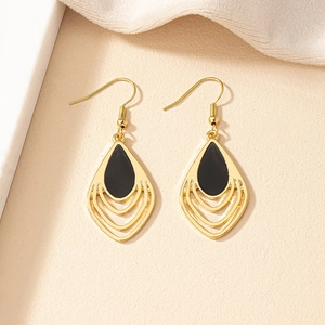 French vintage gold earrings with black teardrop enamel and layered hollow leaf pendants
