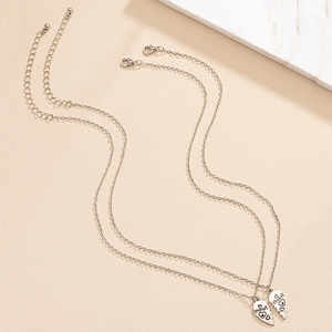 Matching silver heart necklaces for best friends featuring Friends Forever engraving