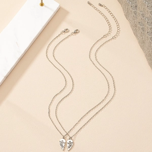 Matching silver heart necklaces with Friends Forever engraving for best friends