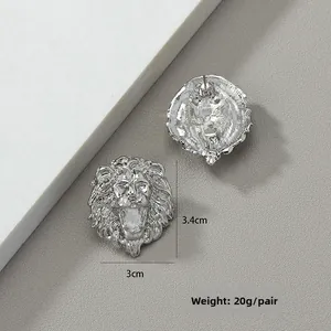 Detailed view of silver lion head earrings with high polish finish and dimensions