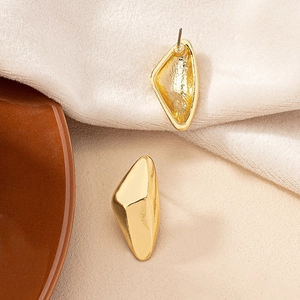 Minimalist irregular geometric gold earrings with a 3D pyramid design and high-polish finish