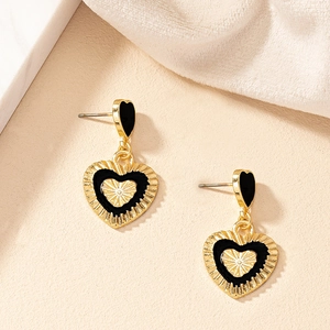 French vintage style gold heart earrings with black enamel and textured metal finish